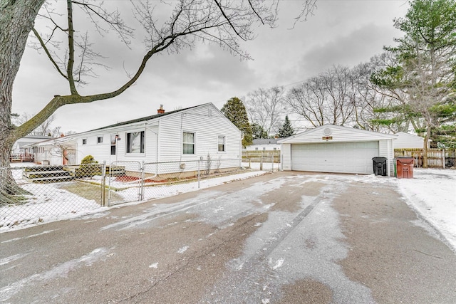 view of property exterior with a garage and an outdoor structure