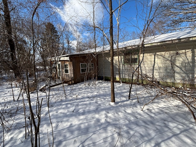 view of snow covered house