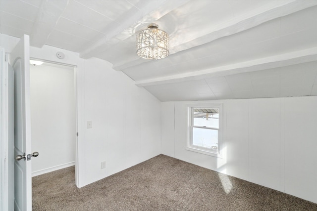 additional living space with carpet floors and vaulted ceiling with beams