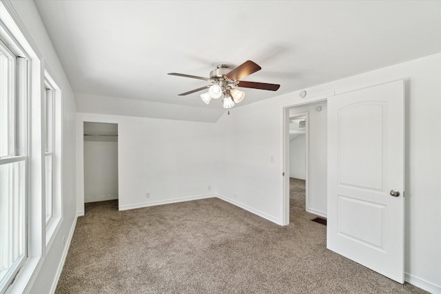 unfurnished bedroom with light carpet, ceiling fan, and a closet