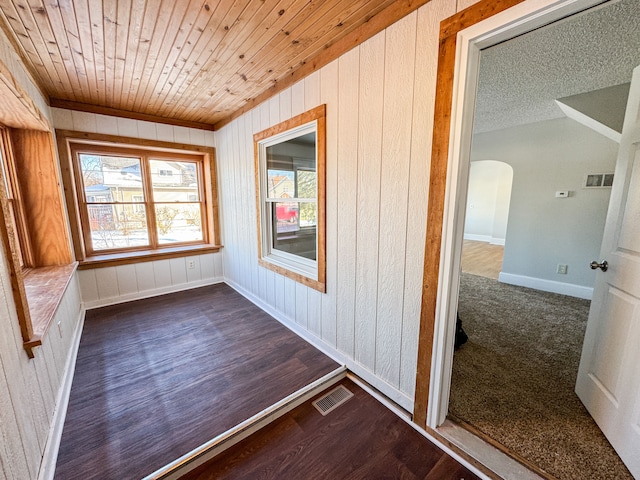 unfurnished sunroom featuring wooden ceiling