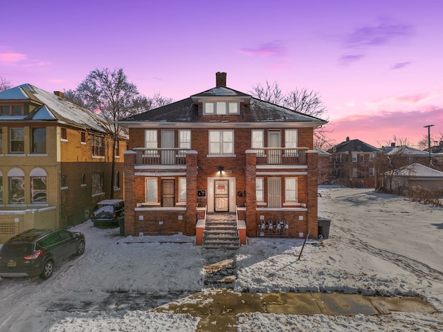 view of front of property featuring a balcony