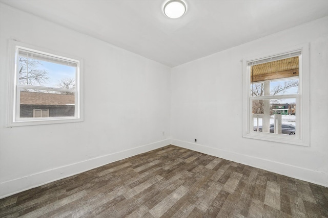 spare room featuring dark hardwood / wood-style flooring