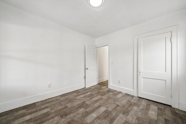 empty room featuring wood-type flooring