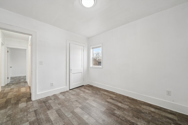 spare room with hardwood / wood-style floors