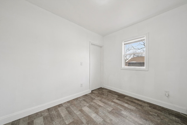 unfurnished room featuring hardwood / wood-style flooring