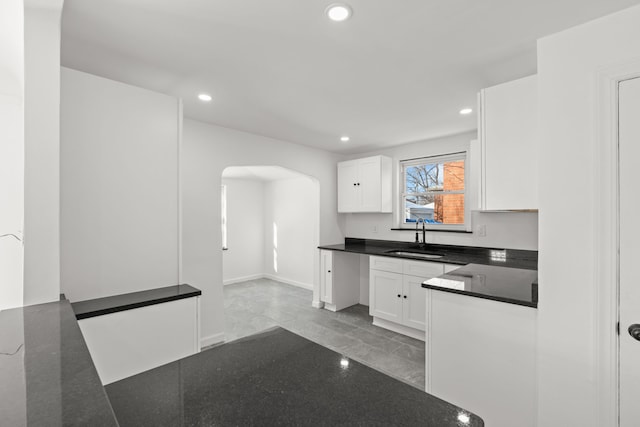 kitchen with sink and white cabinetry