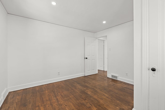 spare room featuring dark hardwood / wood-style flooring