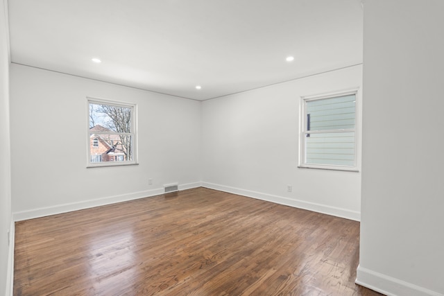 empty room with wood-type flooring