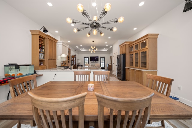 dining space featuring a notable chandelier