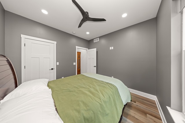 bedroom featuring ceiling fan and light hardwood / wood-style flooring