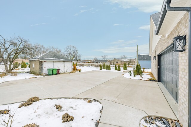 view of home's exterior with an outbuilding