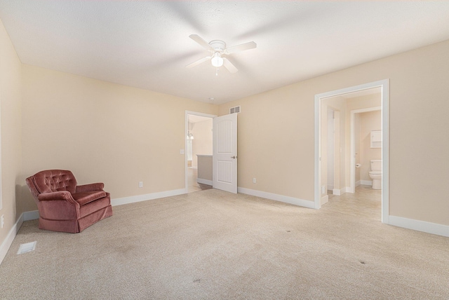 unfurnished room featuring ceiling fan and light colored carpet