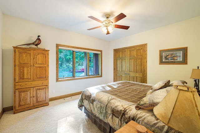 carpeted bedroom featuring ceiling fan