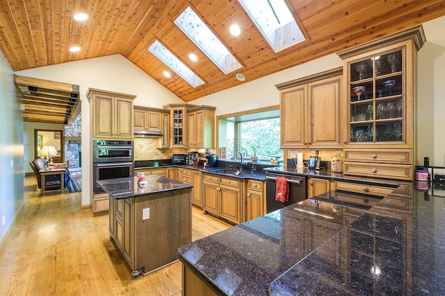 kitchen featuring wood ceiling, dishwasher, double oven, backsplash, and a kitchen island