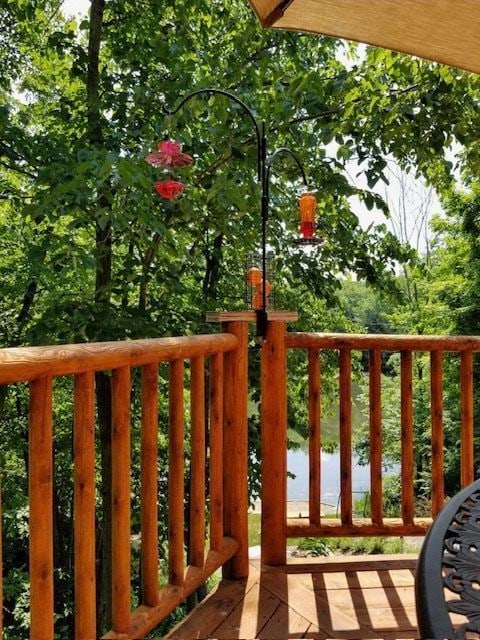 balcony featuring a water view