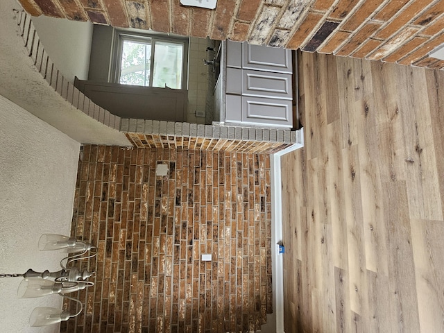 interior space featuring brick ceiling