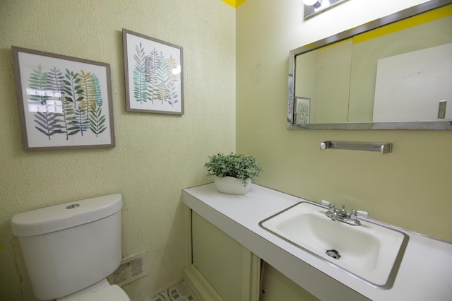 bathroom with sink and toilet