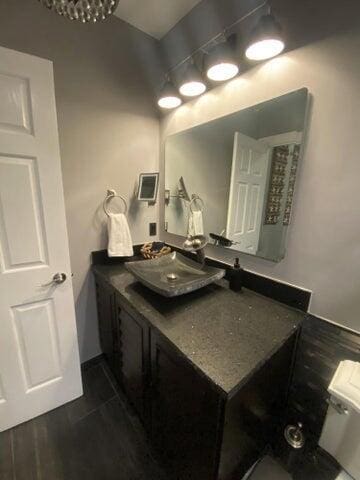 bathroom with vanity and wood-type flooring