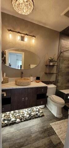 bathroom with toilet and vanity