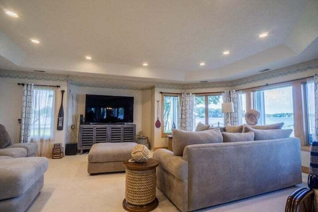 living room with a tray ceiling