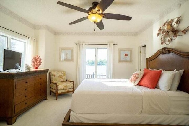 bedroom with ceiling fan, light colored carpet, and access to exterior