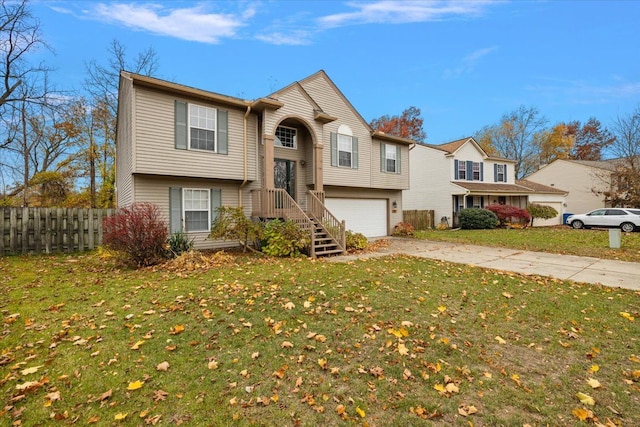 view of front of property with a garage and a front lawn