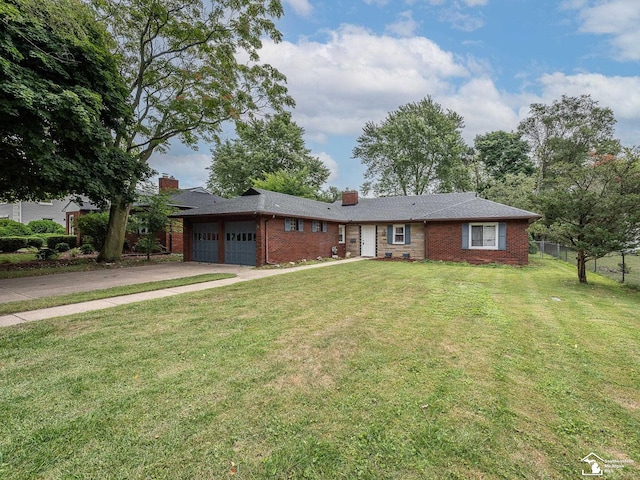 ranch-style home with a front lawn and a garage