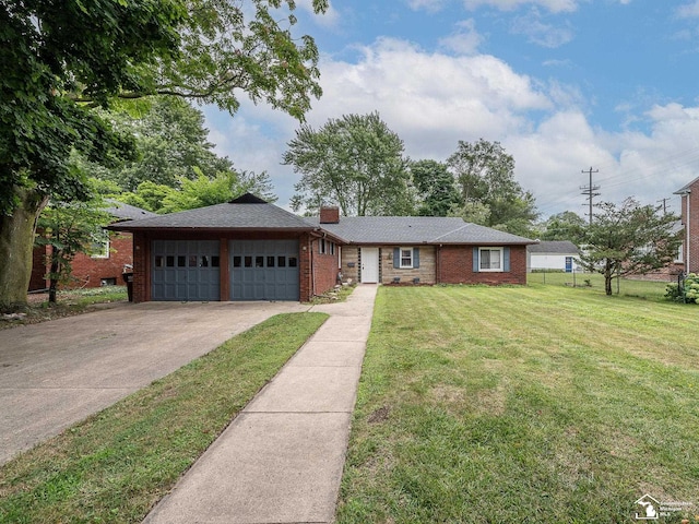 ranch-style house featuring a front lawn and a garage