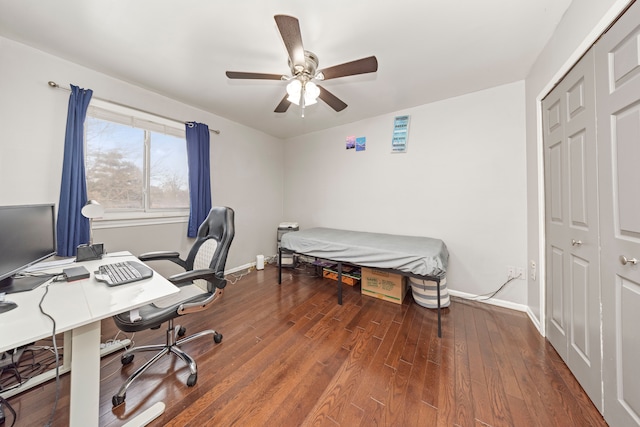 office with ceiling fan and dark hardwood / wood-style floors