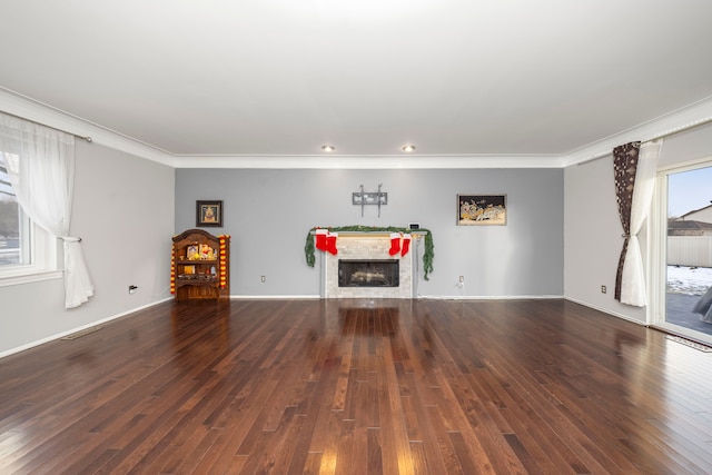 interior space featuring dark wood-type flooring and ornamental molding