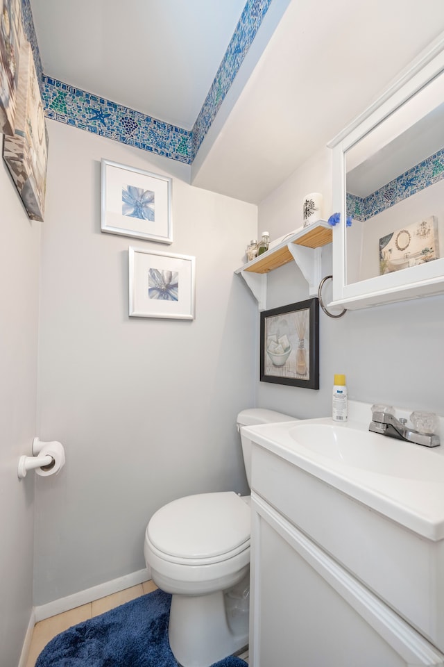 bathroom featuring tile patterned floors, toilet, and vanity