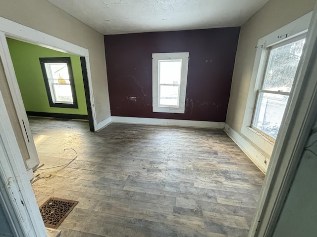 spare room with a textured ceiling