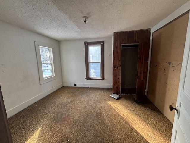 spare room featuring a textured ceiling