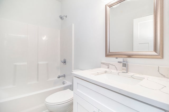 bathroom featuring  shower combination, vanity, and toilet