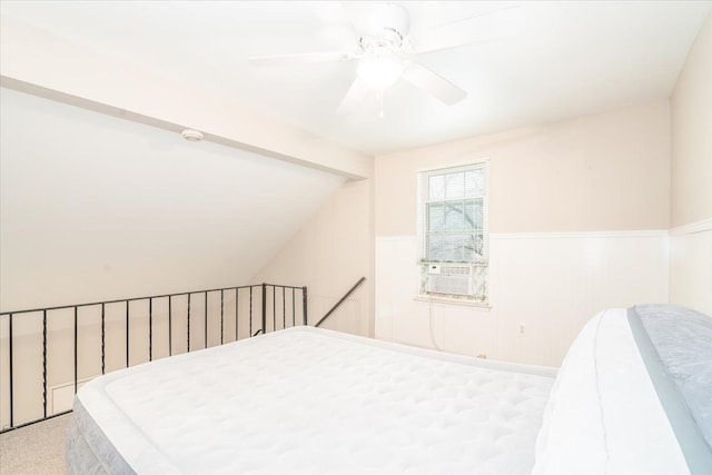 bedroom featuring lofted ceiling, light carpet, and ceiling fan