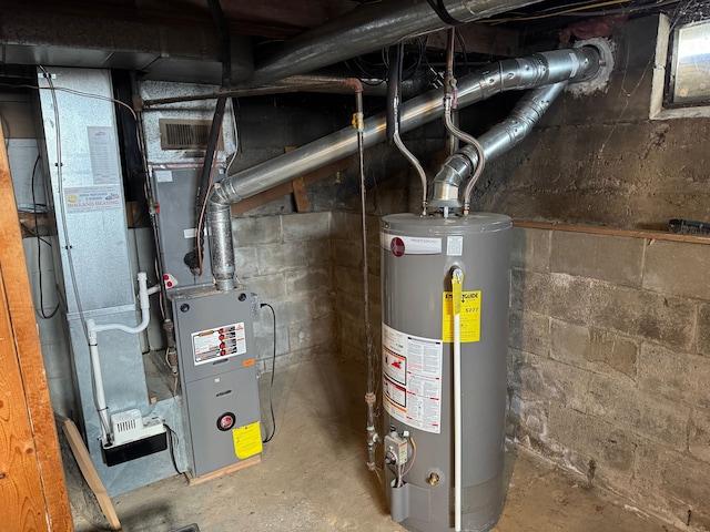 utility room featuring water heater