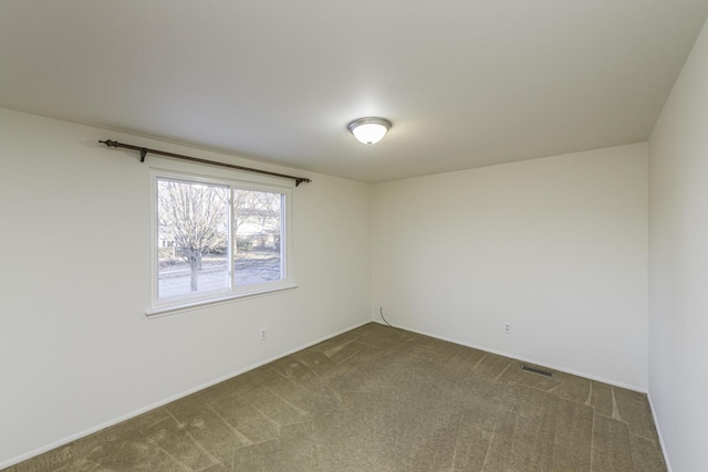 spare room featuring carpet flooring