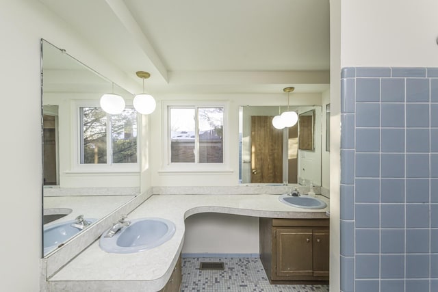 bathroom with tile patterned flooring and vanity