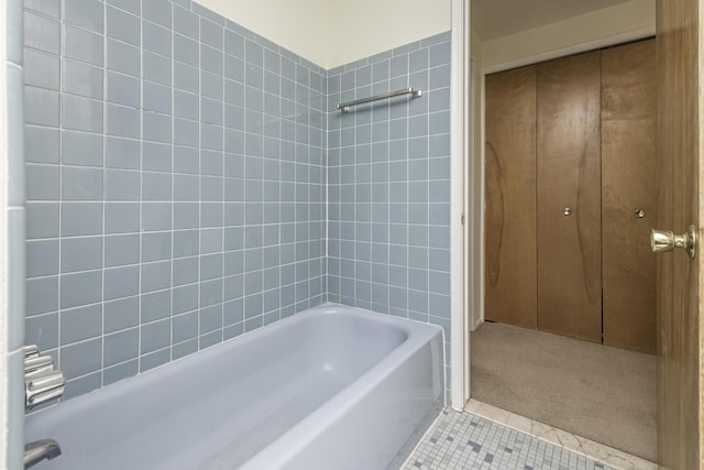 bathroom with tile patterned flooring and shower / bathtub combination