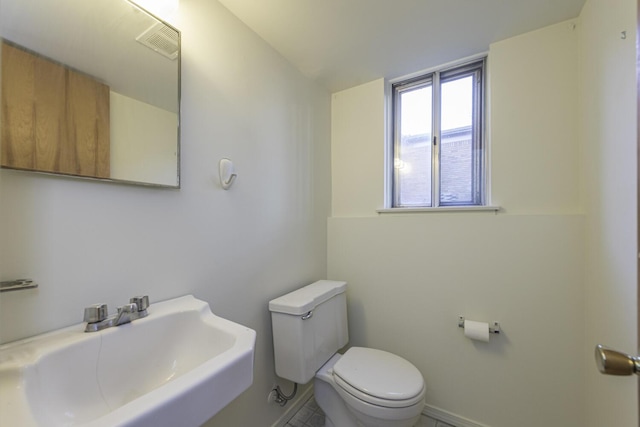 bathroom featuring sink and toilet