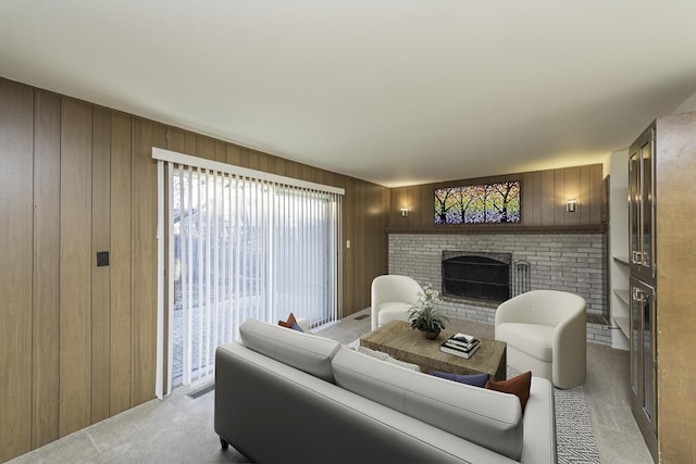 living room featuring wood walls and a fireplace