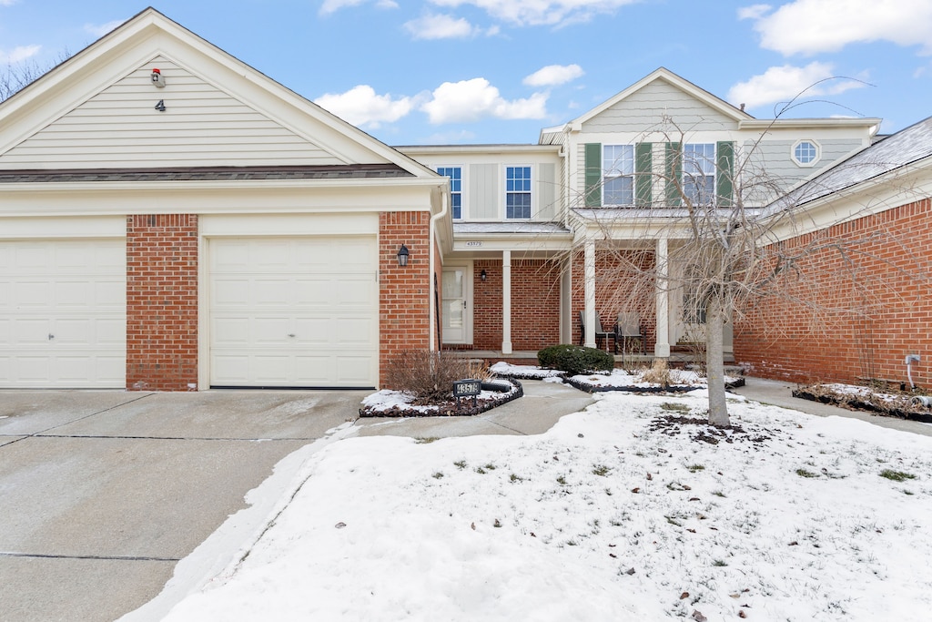 view of front of house featuring a garage and covered porch