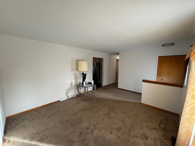 empty room with carpet flooring