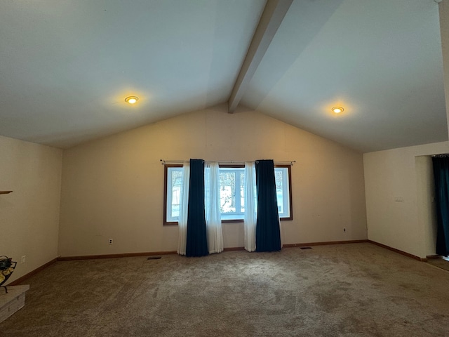 unfurnished room featuring carpet floors and vaulted ceiling with beams