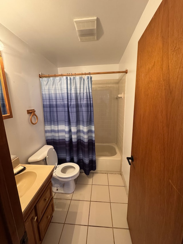 full bathroom featuring toilet, tile patterned floors, vanity, and shower / bath combo with shower curtain