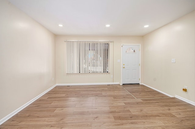 unfurnished room featuring light wood-type flooring