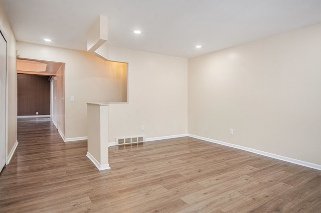 spare room featuring light hardwood / wood-style floors