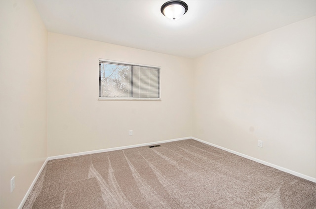 spare room featuring carpet floors