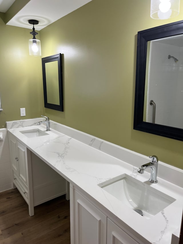 bathroom featuring hardwood / wood-style floors and vanity